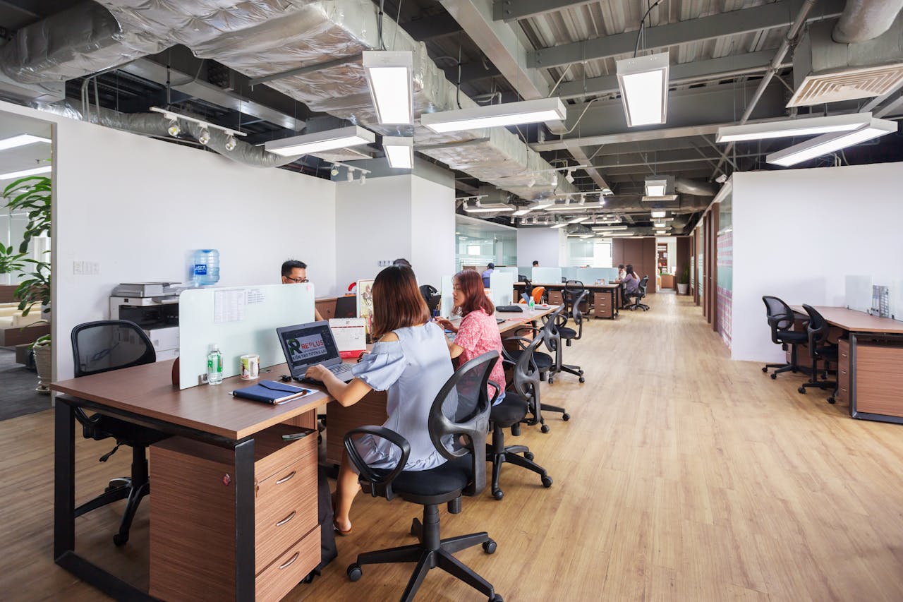 Spacious modern office in Vietnam with employees collaborating at desks.